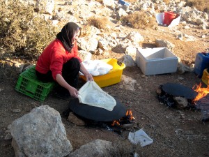 Woman cooking on a saj. Photo courtesy of Cynthia Shafer-Elliott.