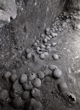 Mass grave in cave Lachish showing skulls of some individuals buried after the Assyrian conquest of Lachish under Sennacherib in 701 BC (from Lachish III, Pl. 4).