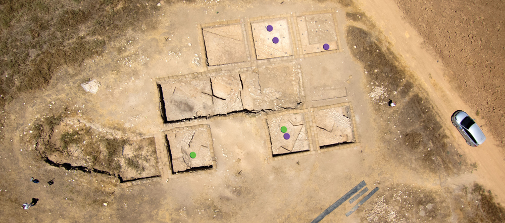 Khirbet Summeily at the end of excavations in July. Violet dots mark the findspots of bullae found in Phase 5 or in sub-floor foundation deposits of Phase 4. Green dots mark the findspots of bullae in later phases. North is generally toward the top of the page. Photograph by W. Isenberger and D. Farrow for the Hesi Regional Project.