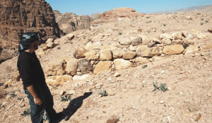 Tuttle standing at the southwest corner of the interior, smaller platform, looking north. (Photo by Q. Tweissi)